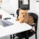 Cute Dog Working On Laptop In The Kitchen
