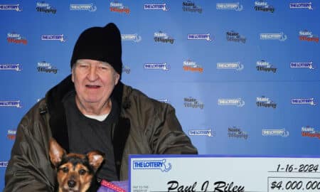 Paul Riley And Raven Claiming Their Lottery Prize