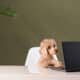Poodle At A Work Table With A Laptop